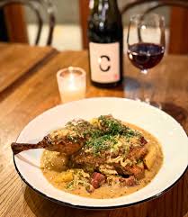 L'Oursin signature dishes The menu changes seasonally. Butter Poached Halibut, Dungeness Crab, Duck Confit, and Steak Frites